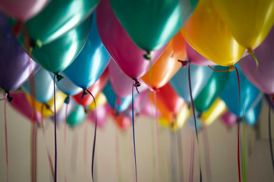 A ceiling full of colourful party balloons